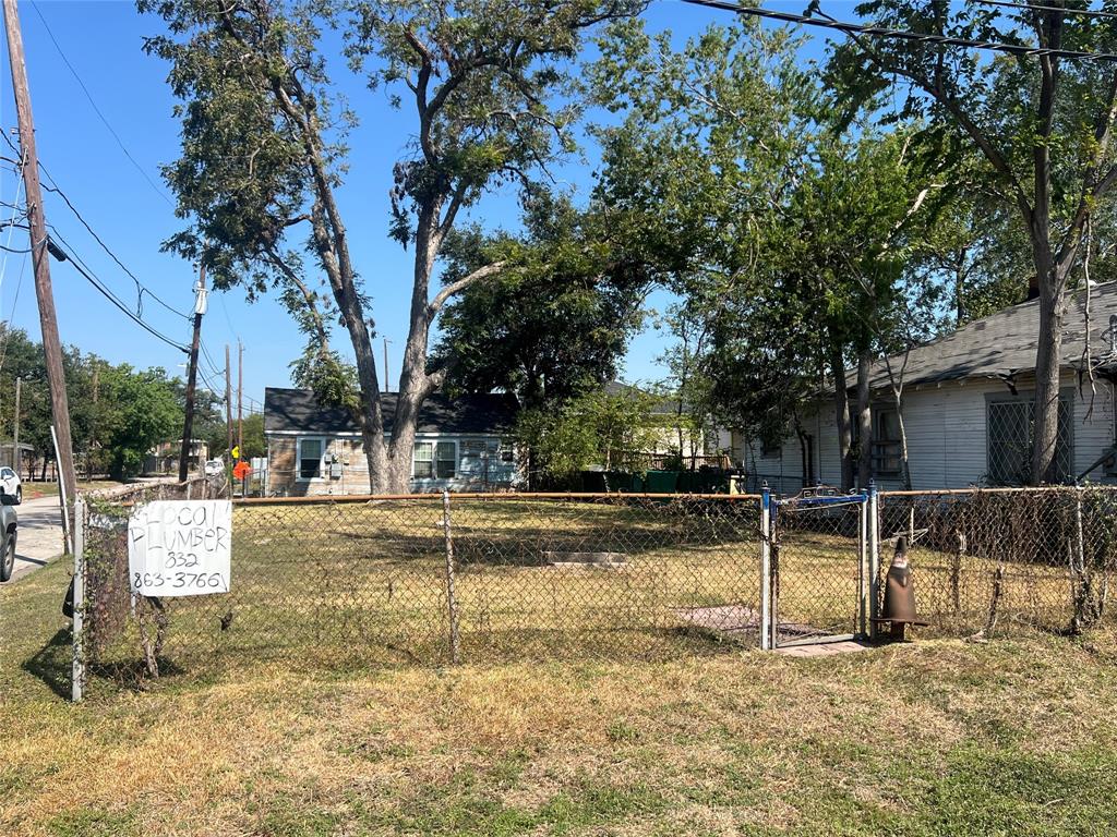 a view of a yard with swimming pool