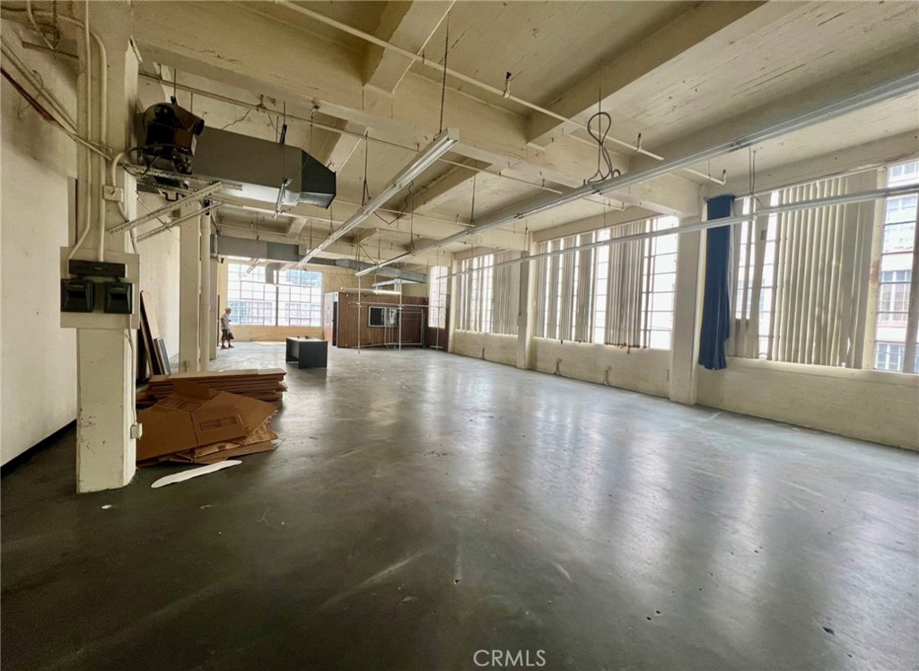 a view of a hall with wooden floor