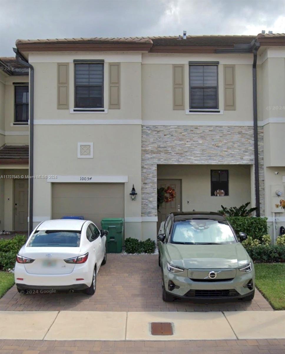 a car parked in front of a house