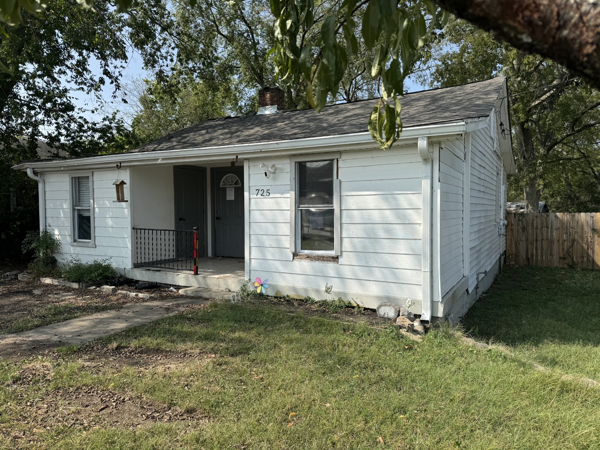 front view of a house with a yard