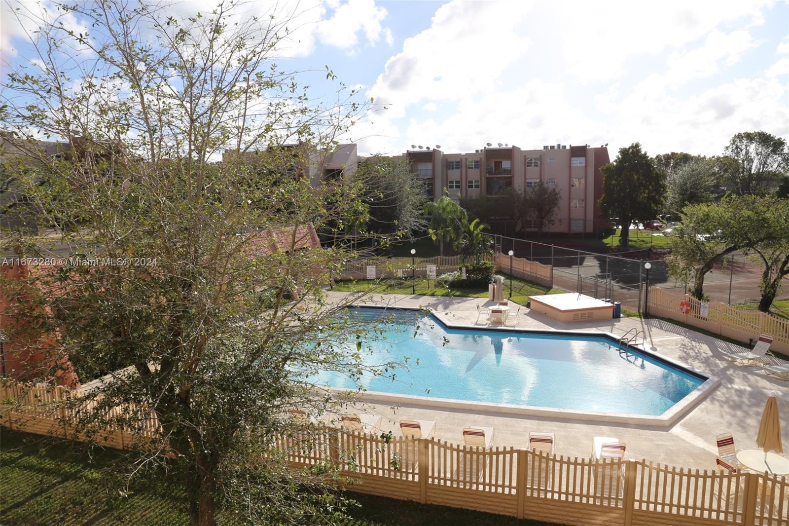 a view of a swimming pool with a patio