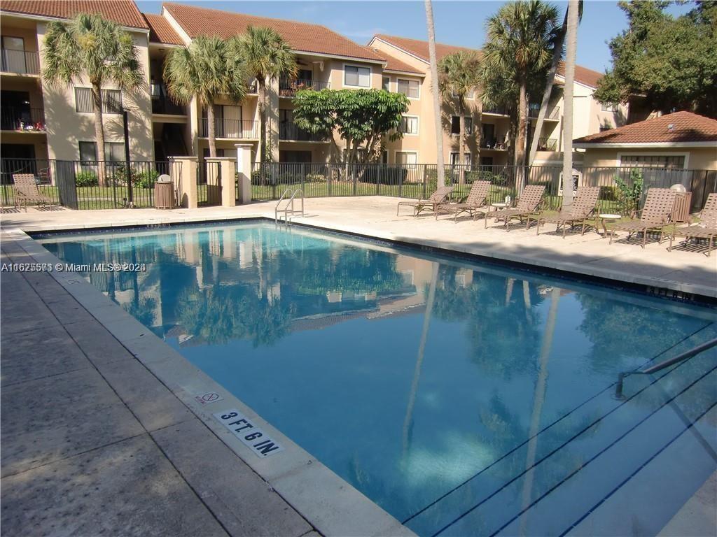 a view of swimming pool with outdoor seating