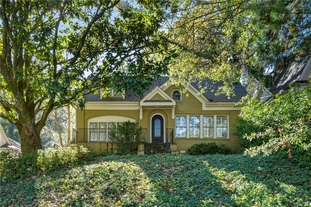 a front view of a house with garden