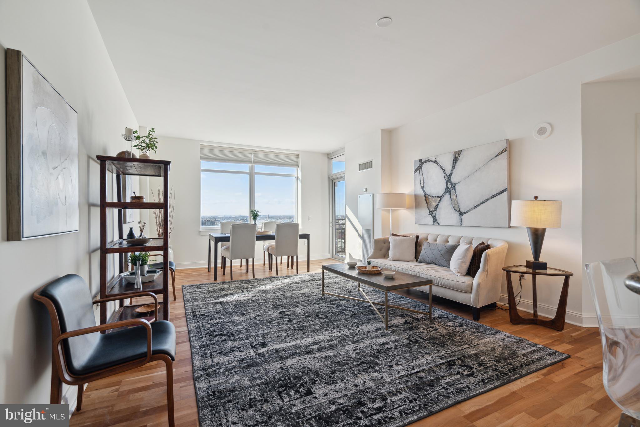 a living room with furniture and a rug