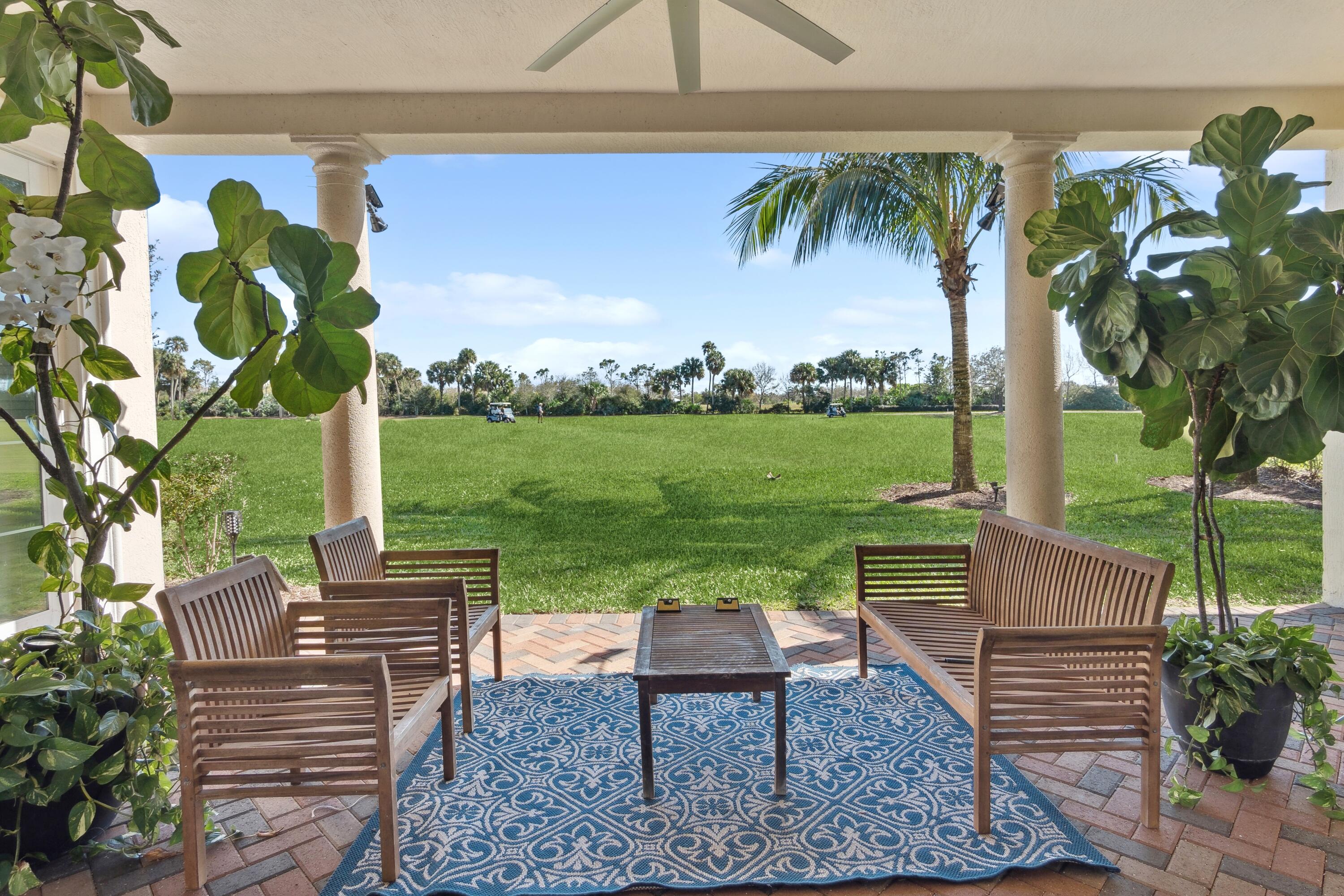 a view of a sitting area with furniture and garden