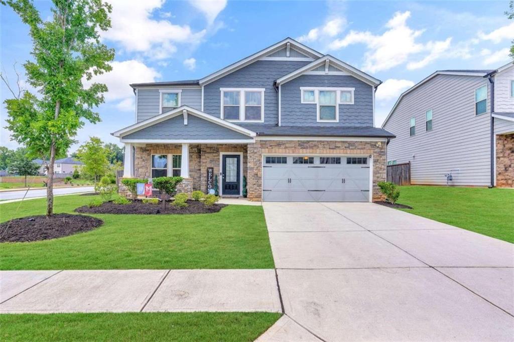 a front view of a house with a yard