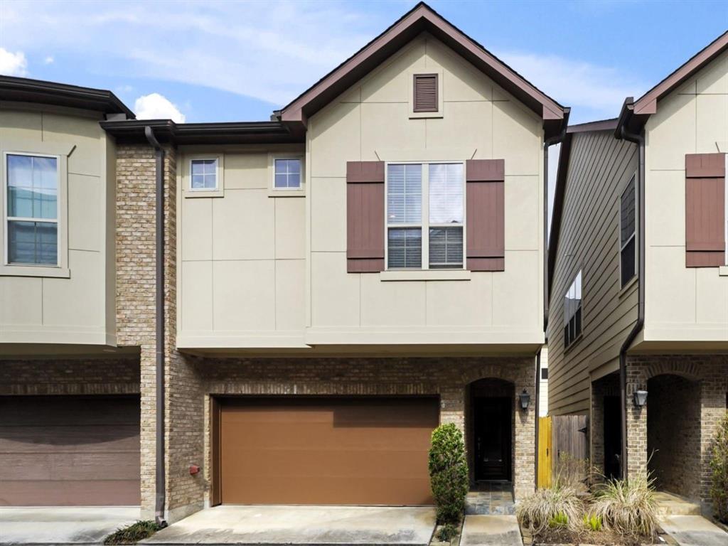 a front view of a house with garage