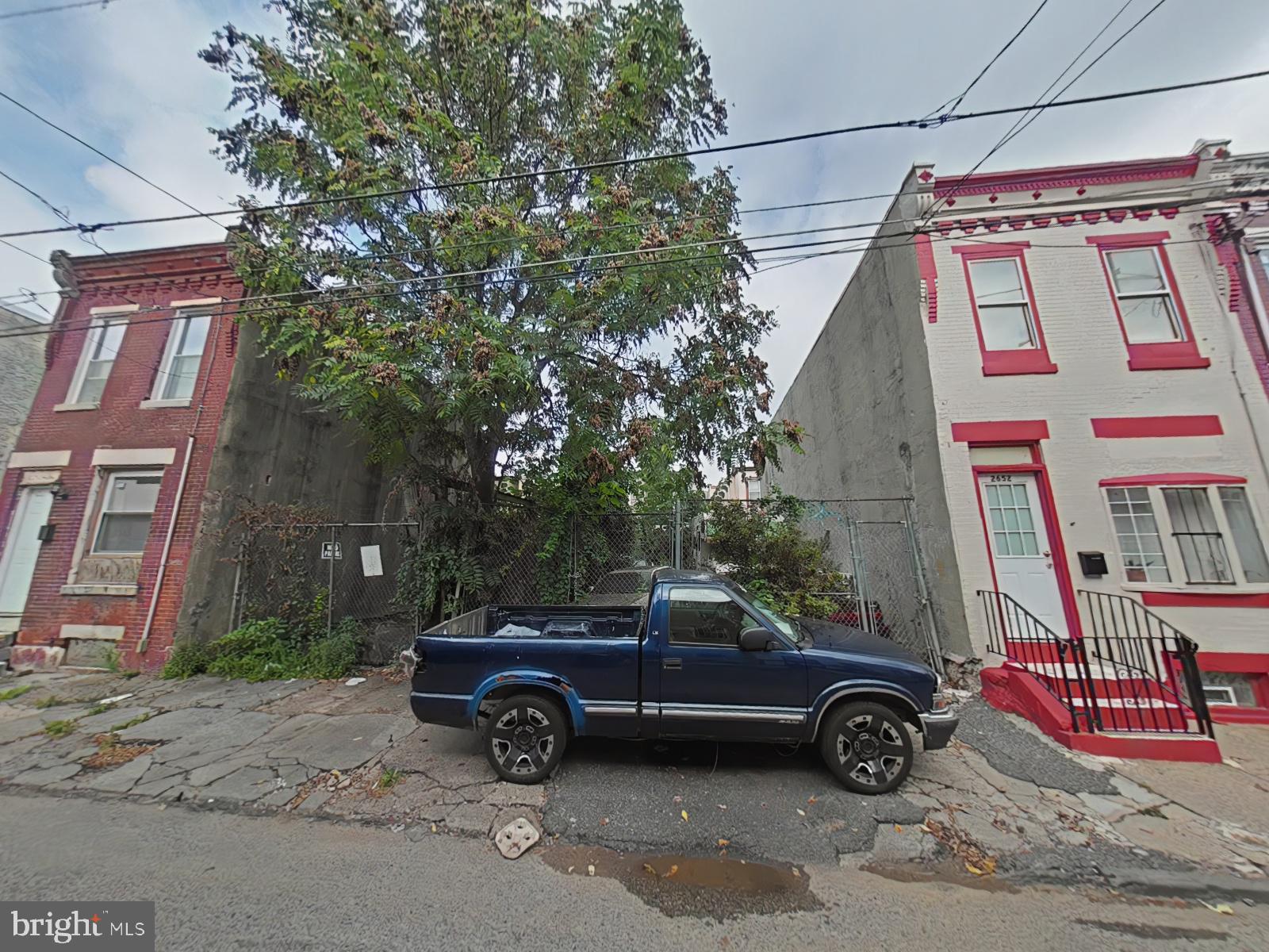 a view of a car parked in front of a house