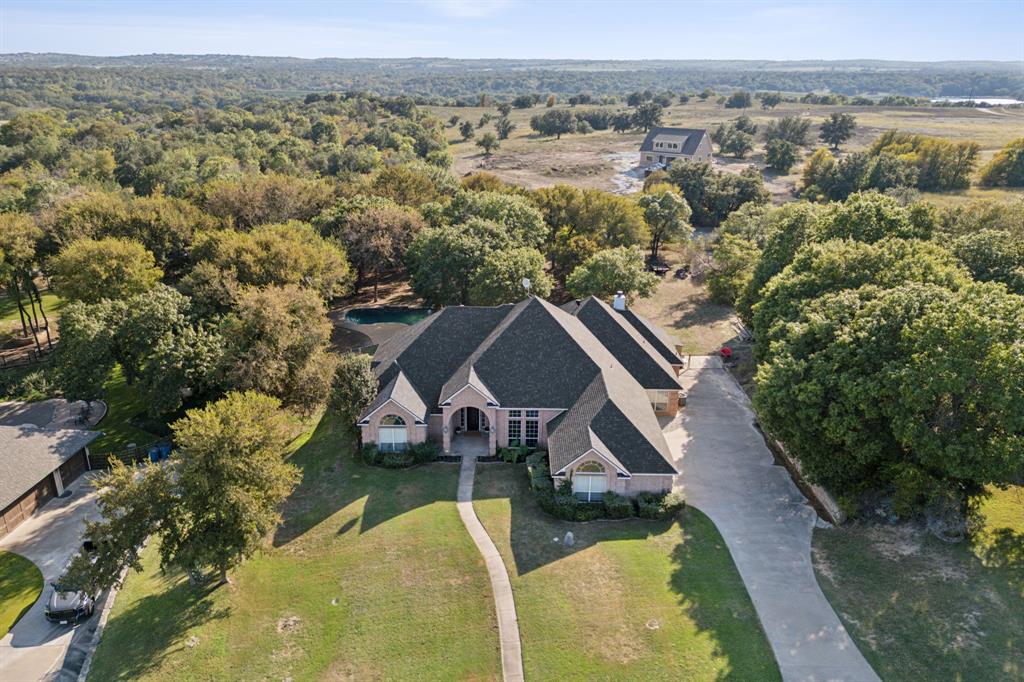 an aerial view of house with yard