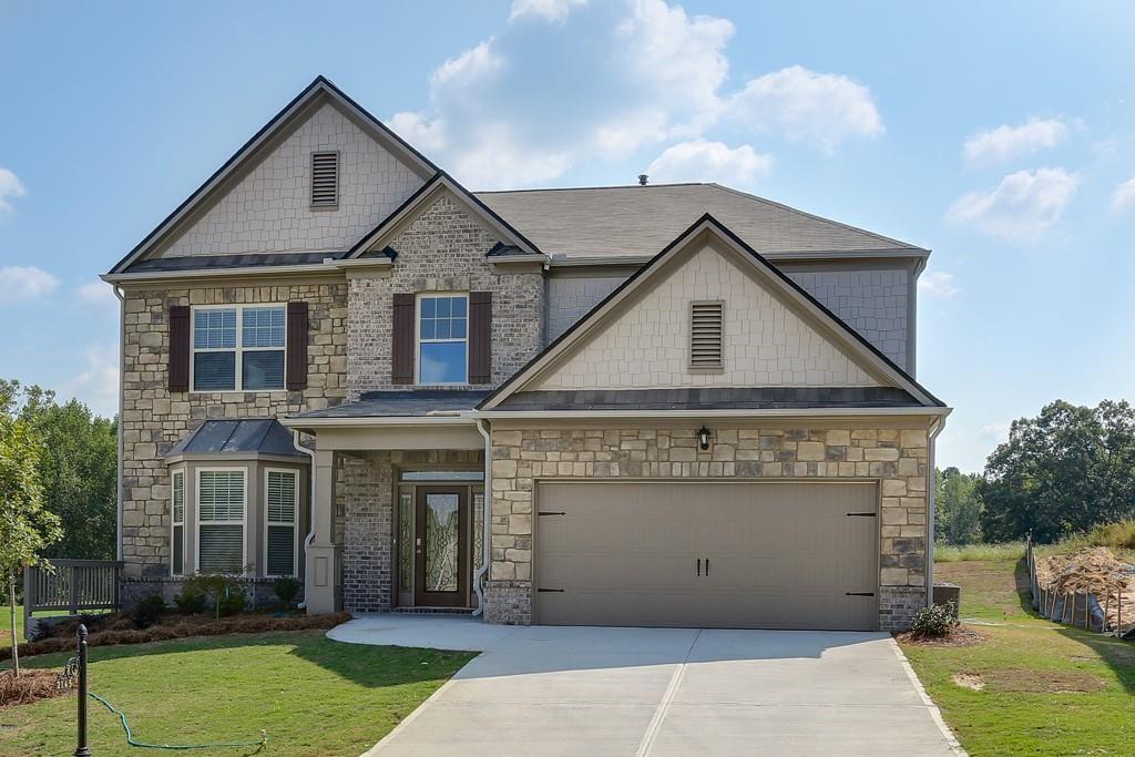 front view of a house with a yard