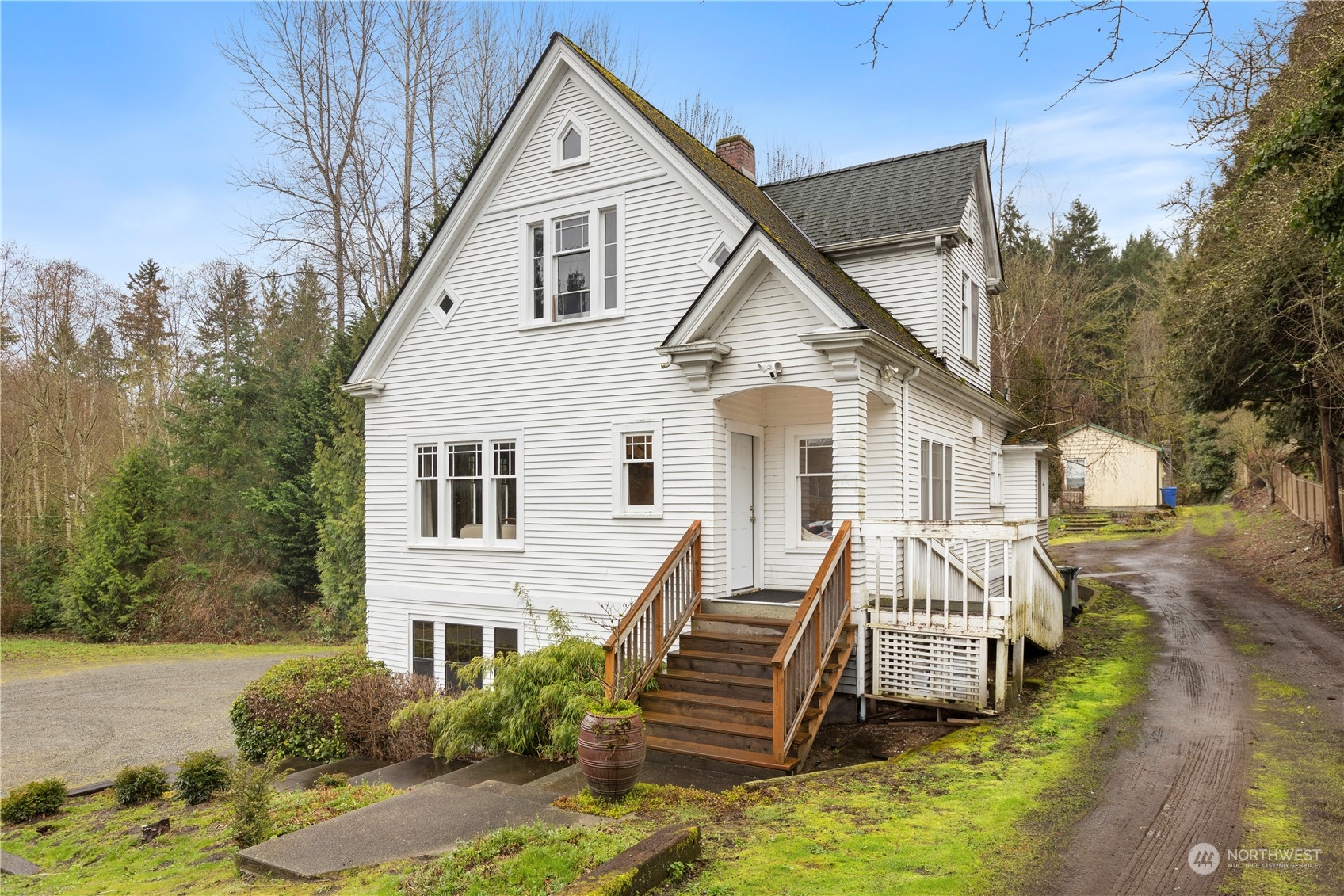 a view of a house with a yard and balcony