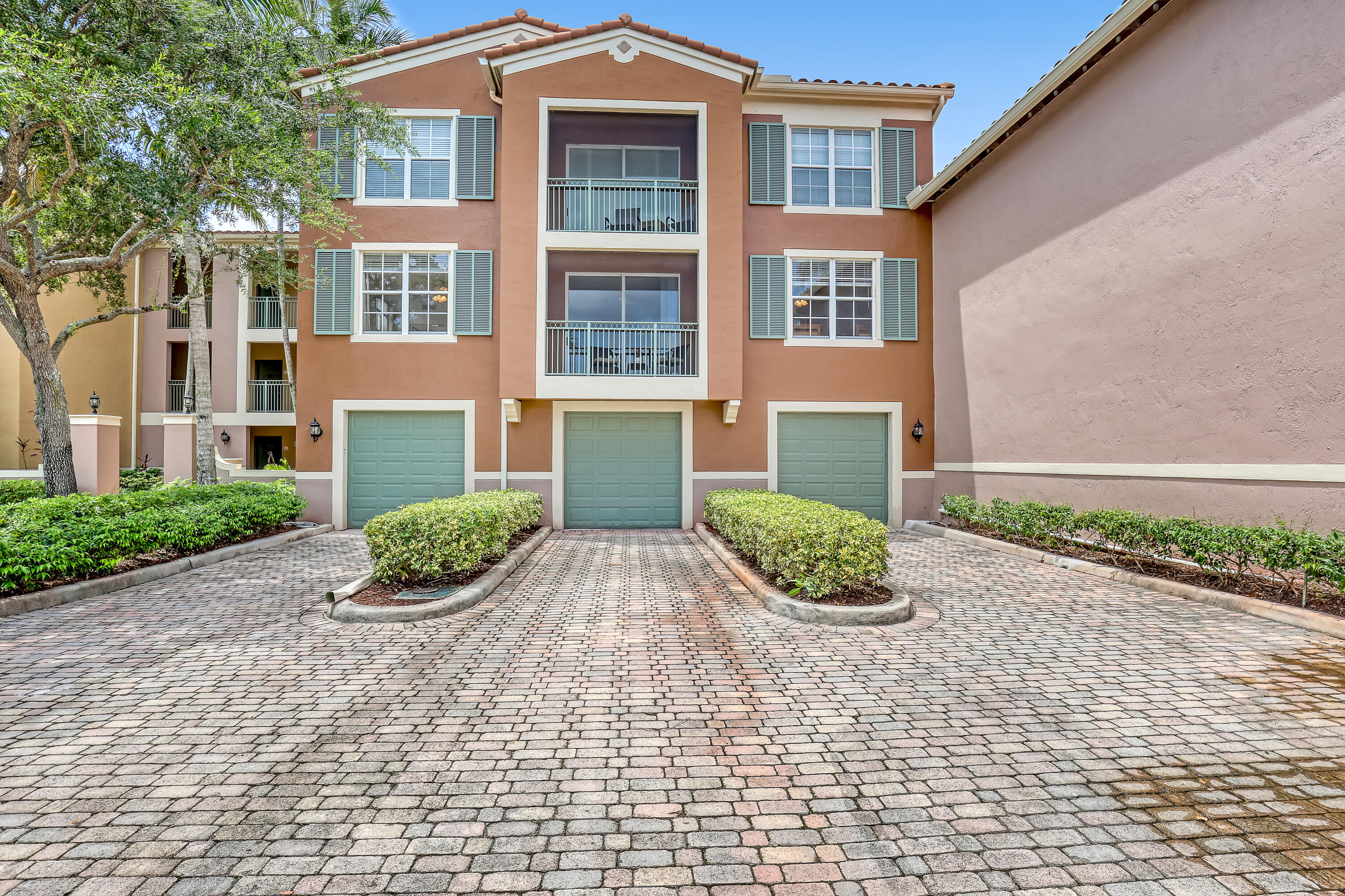 a view of a brick building next to a yard