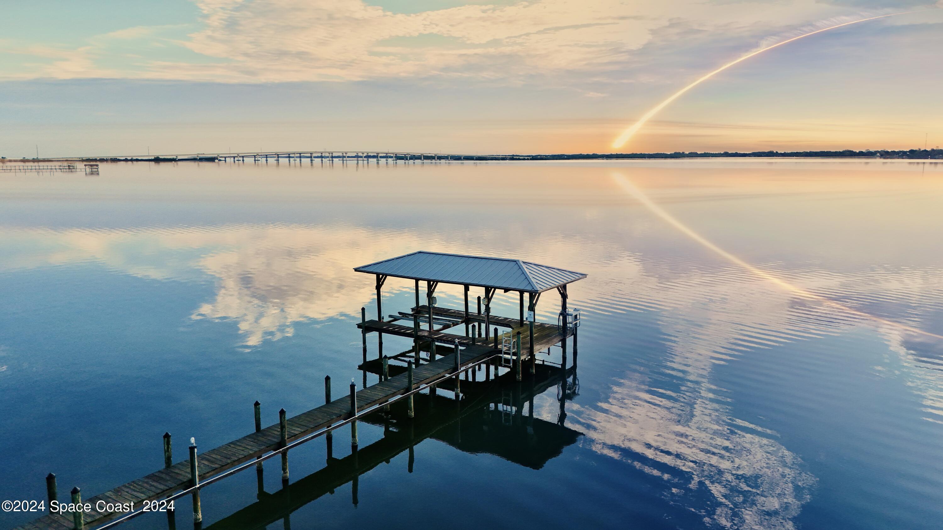 a view of a lake from a balcony