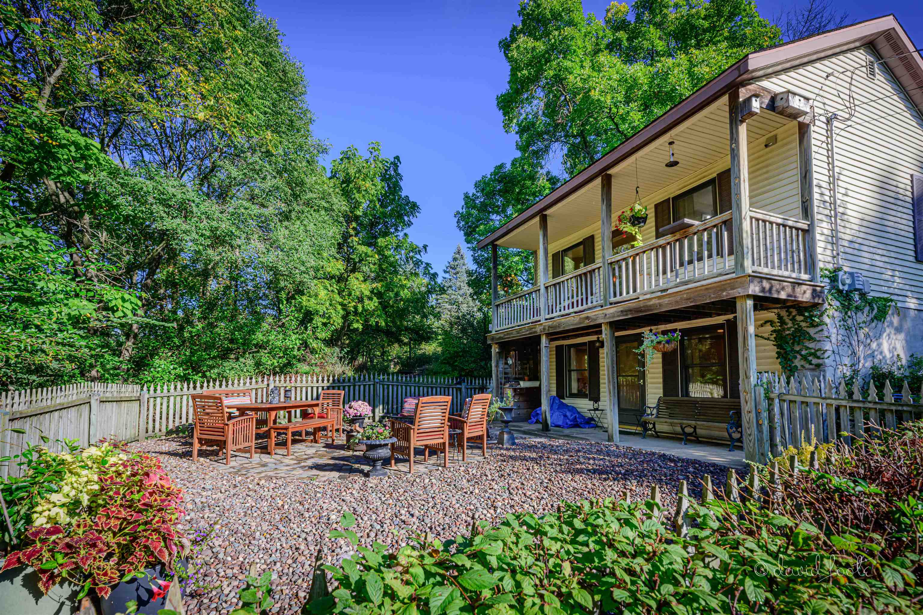 a view of a house with sitting area and garden