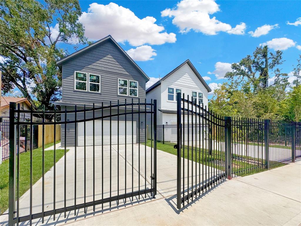 a view of a wrought iron fences in front of house