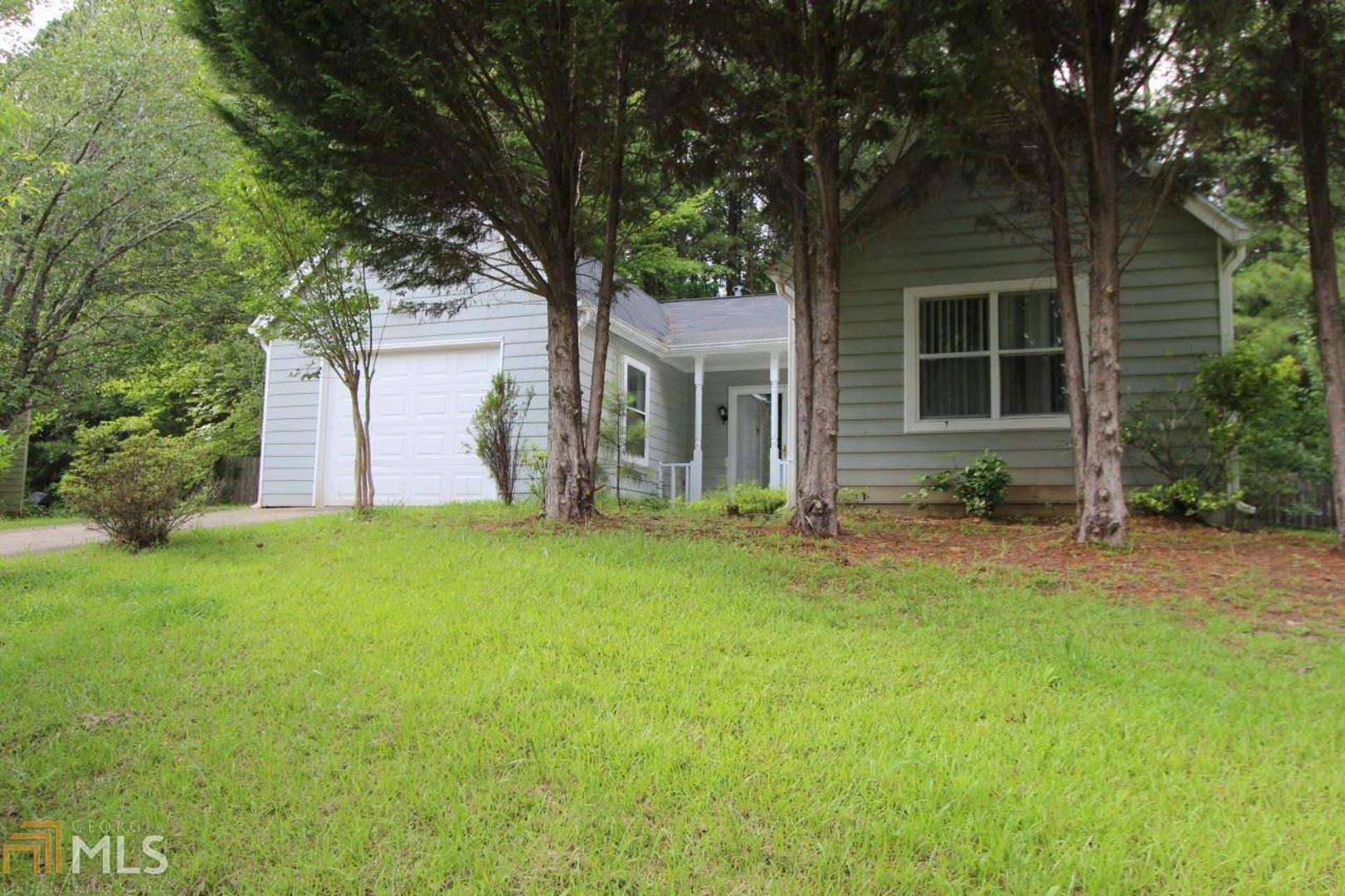 front view of a house with a yard