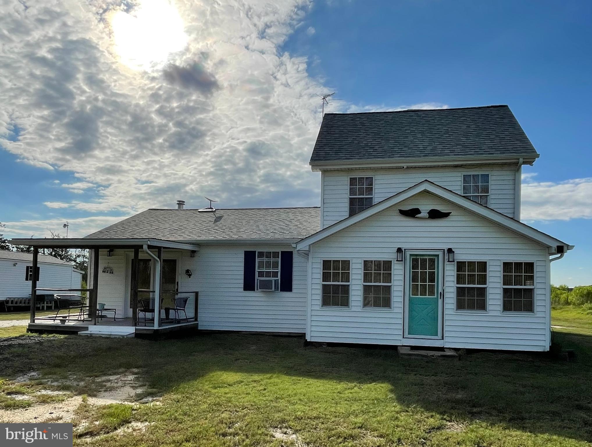 a front view of a house with a small yard