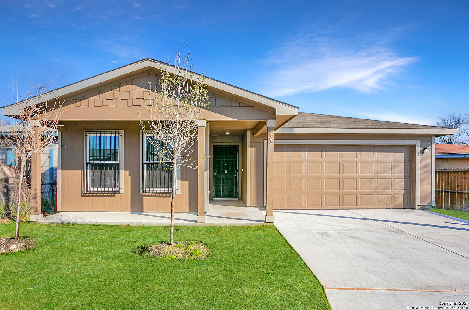 front view of a house with a yard