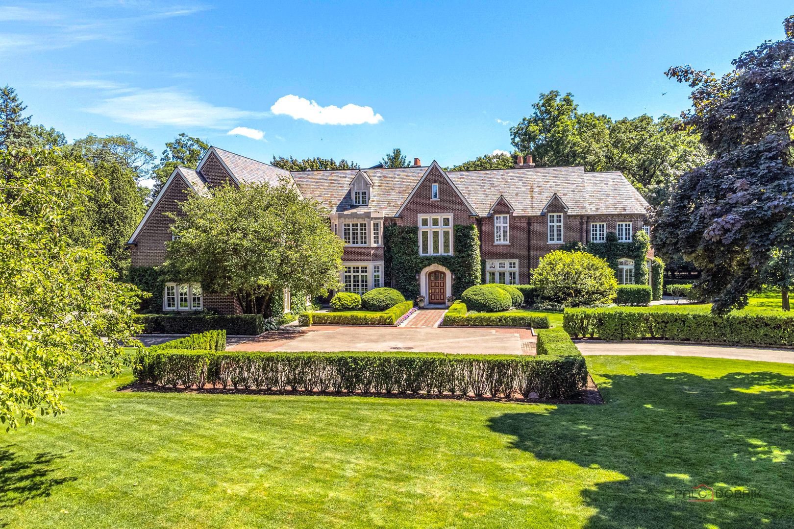 a front view of house with yard and swimming pool