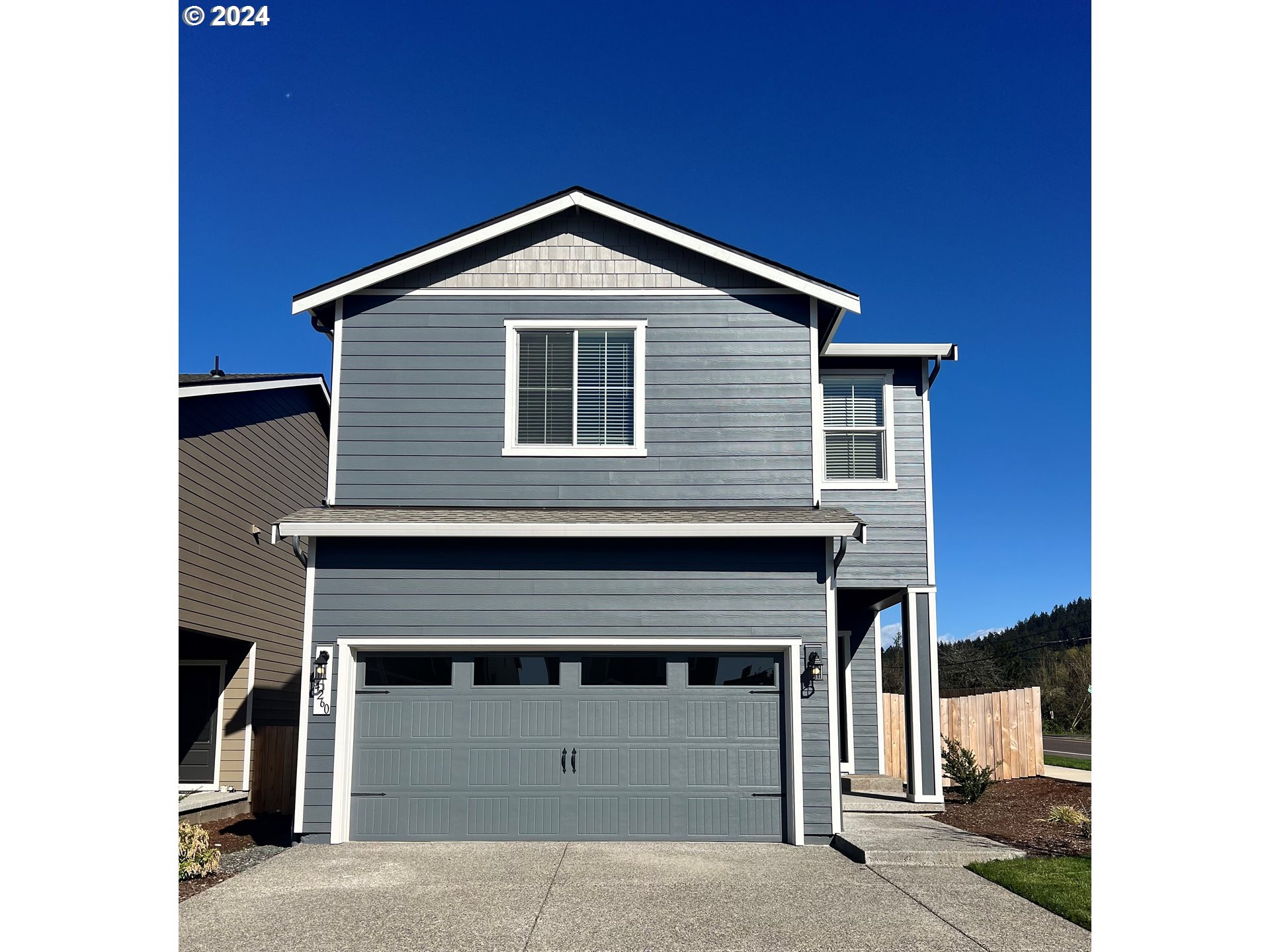 a front view of a house with garage