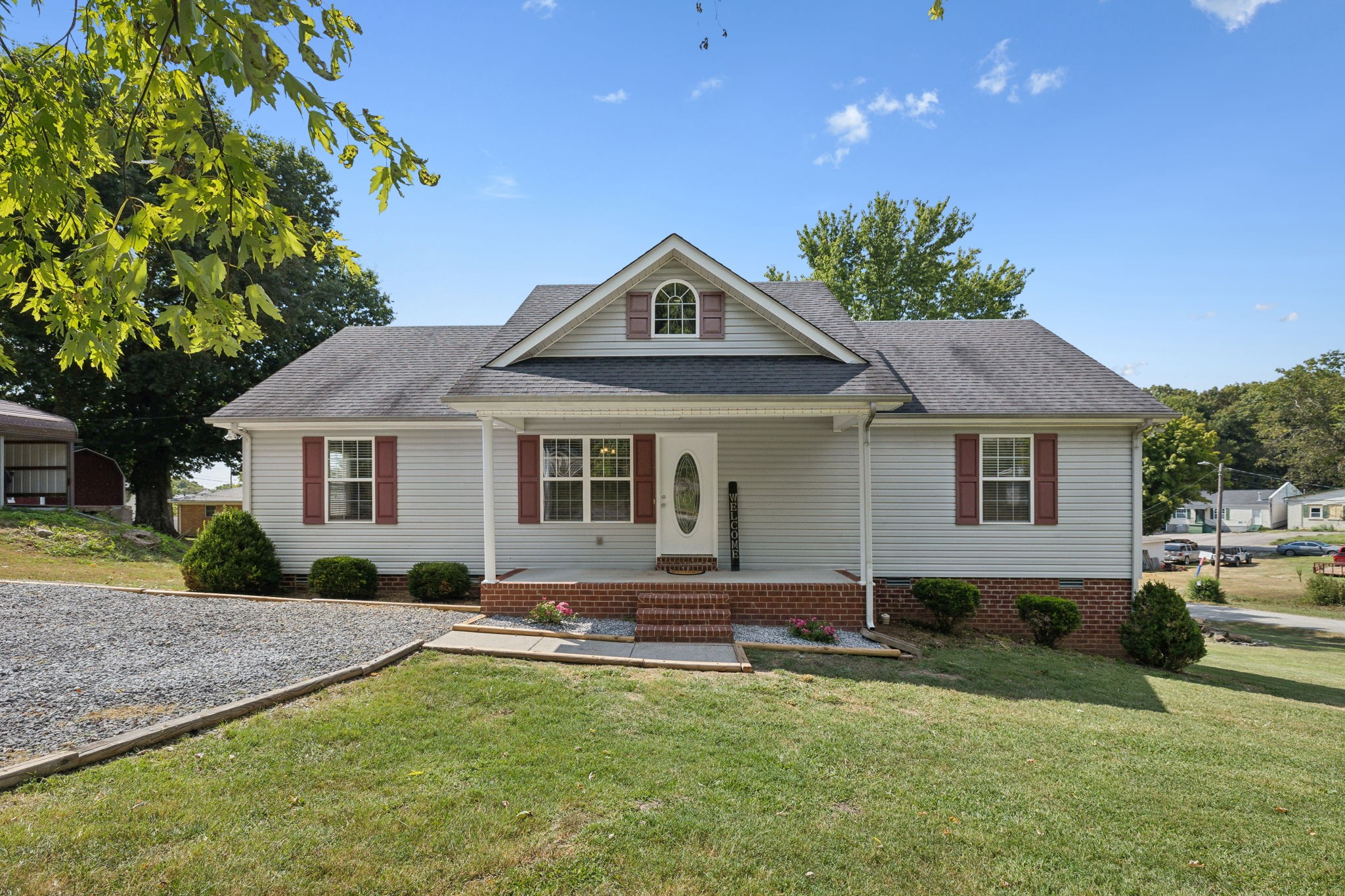 a front view of a house with garden