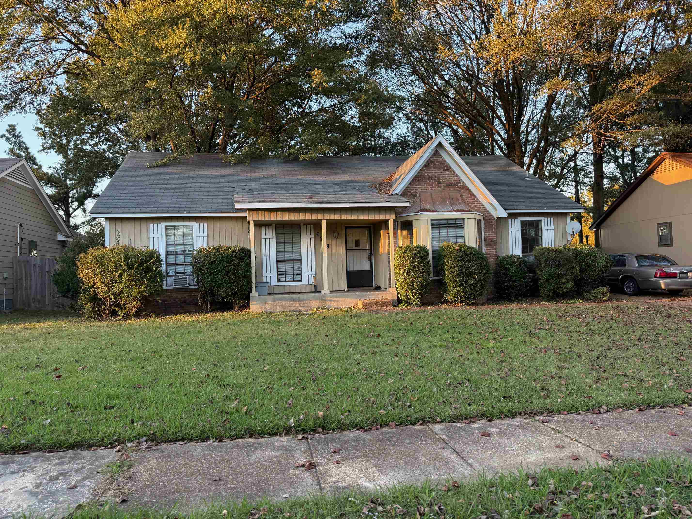 a front view of a house with a garden