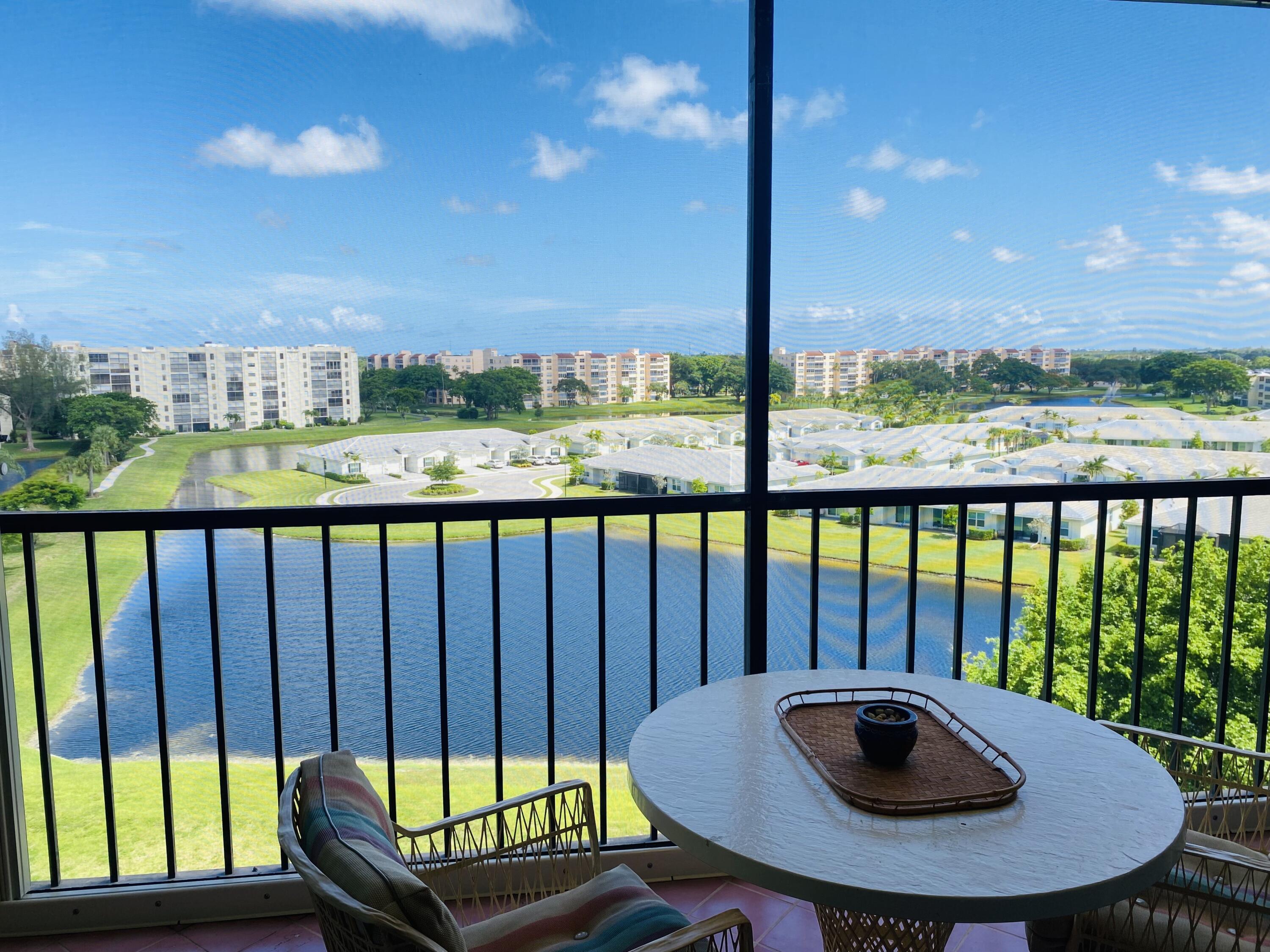 a view of a balcony with mountain view and wooden floor