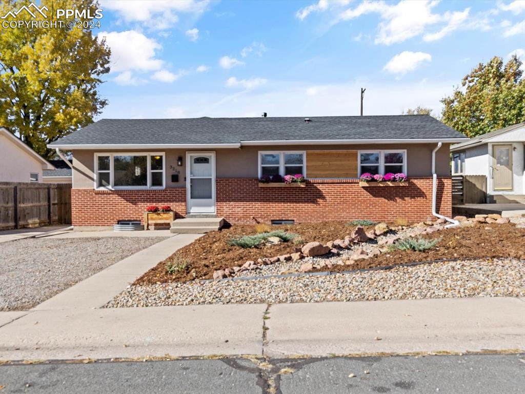 front view of a house with a yard