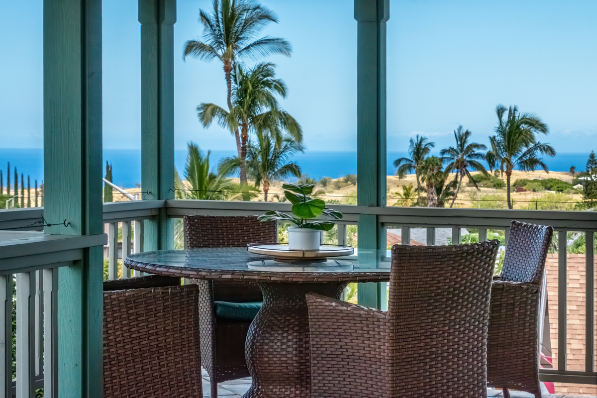 a view of a balcony with chairs and a table