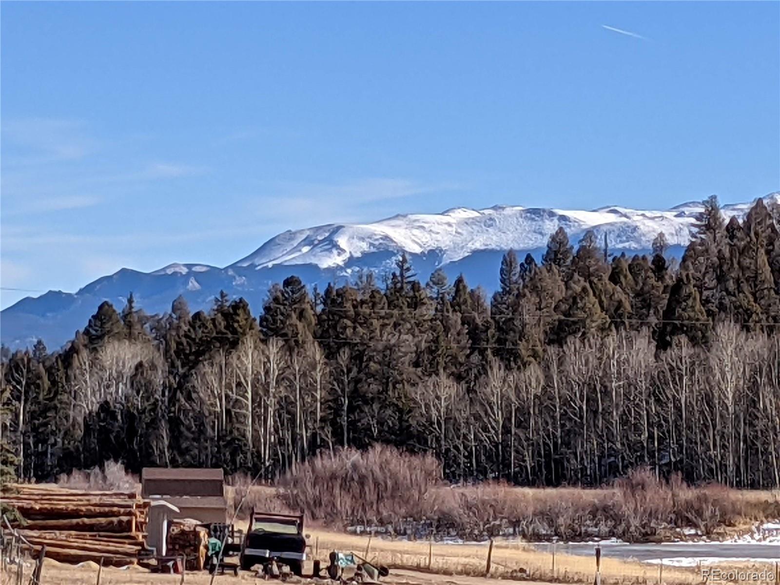 a view of a house with a mountain in the background