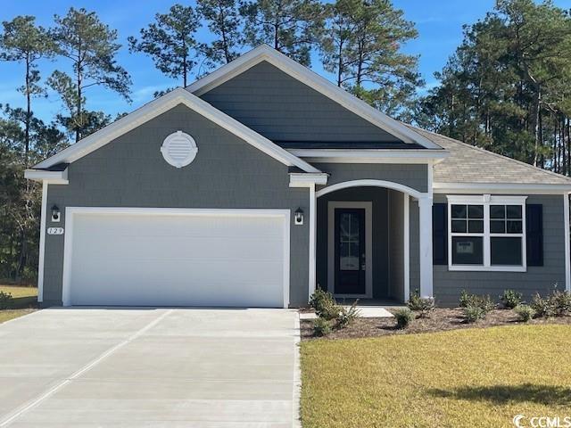 View of front of home featuring a garage and a fro