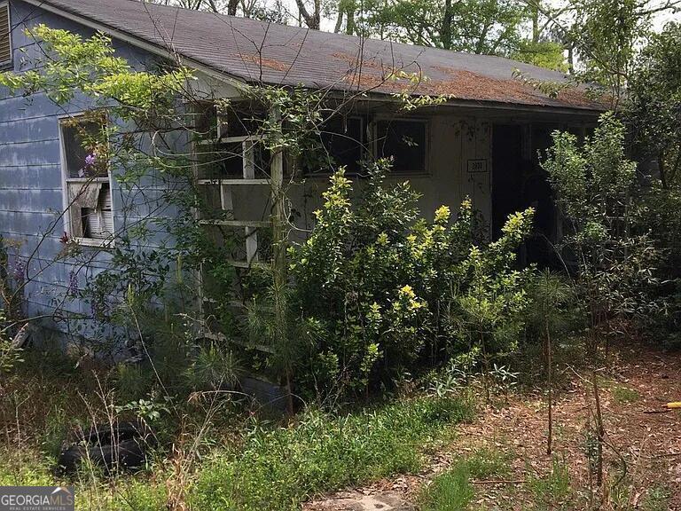 a view of a house with a tree