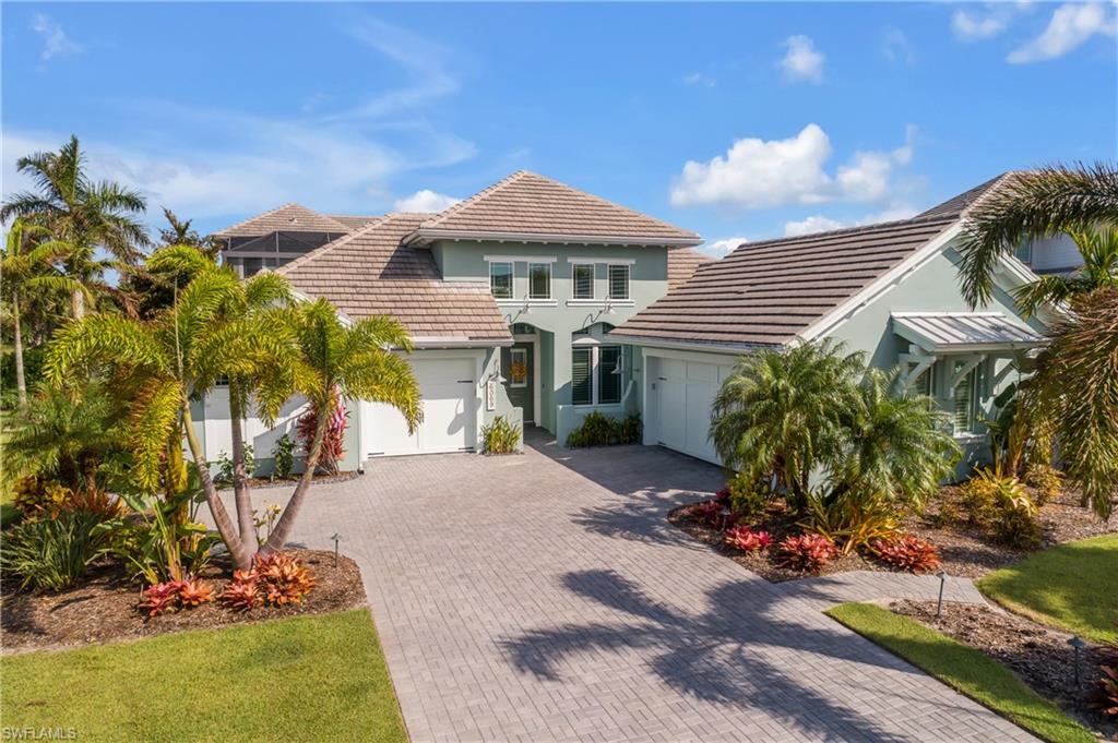 Front view of property featuring a 2 car garage and a 1 car. Note the beautiful landscaping.