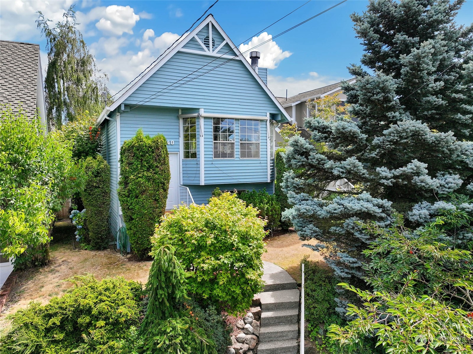 a front view of a house with garden