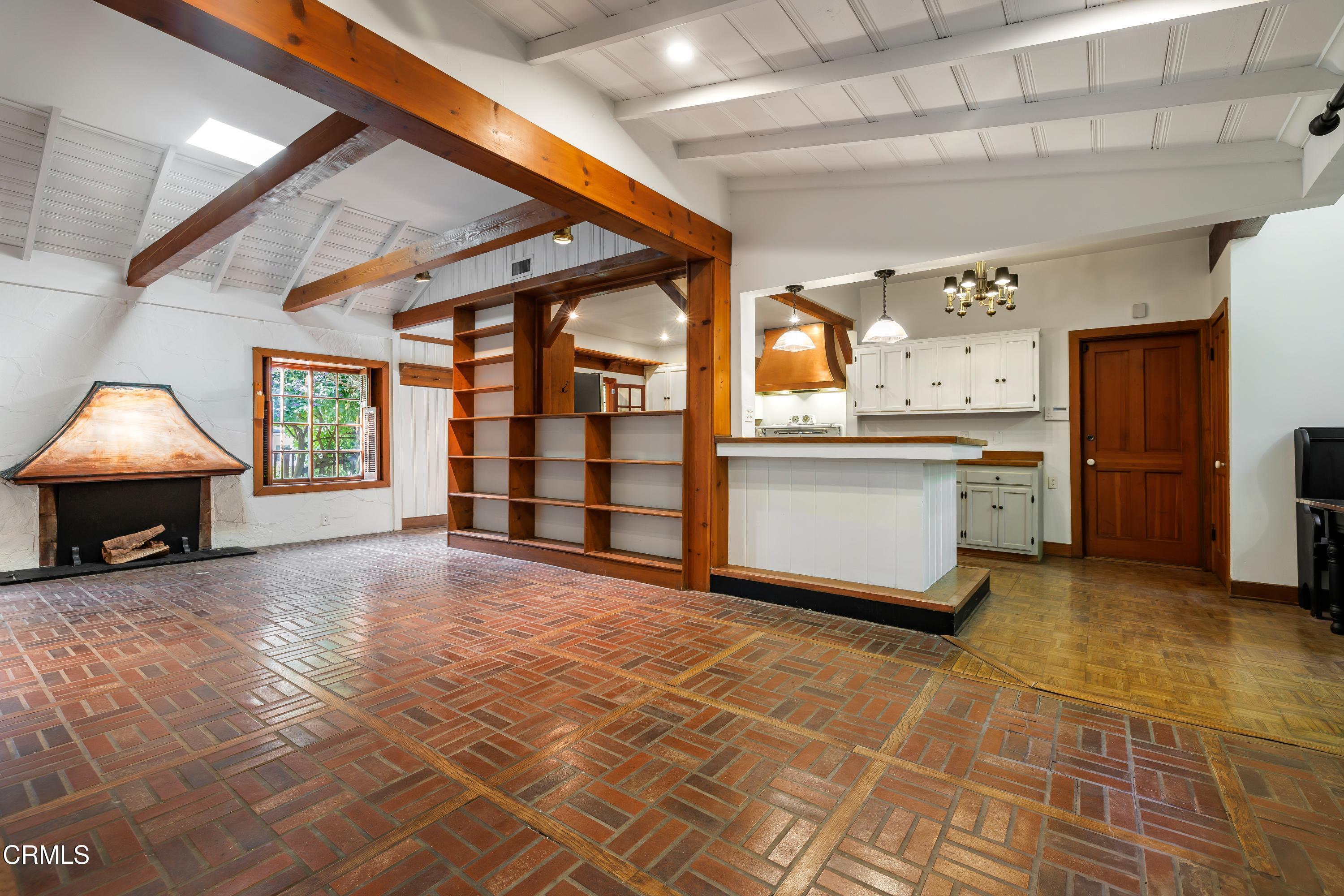 a view of a kitchen with a stove cabinets and a kitchen