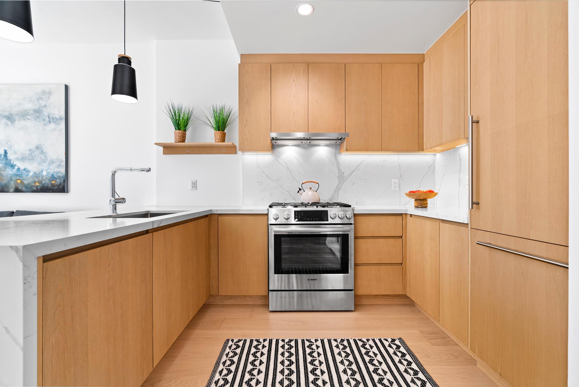 a kitchen with stainless steel appliances a refrigerator and a sink