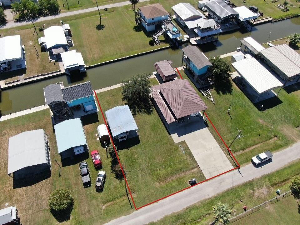 an aerial view of a house with a yard