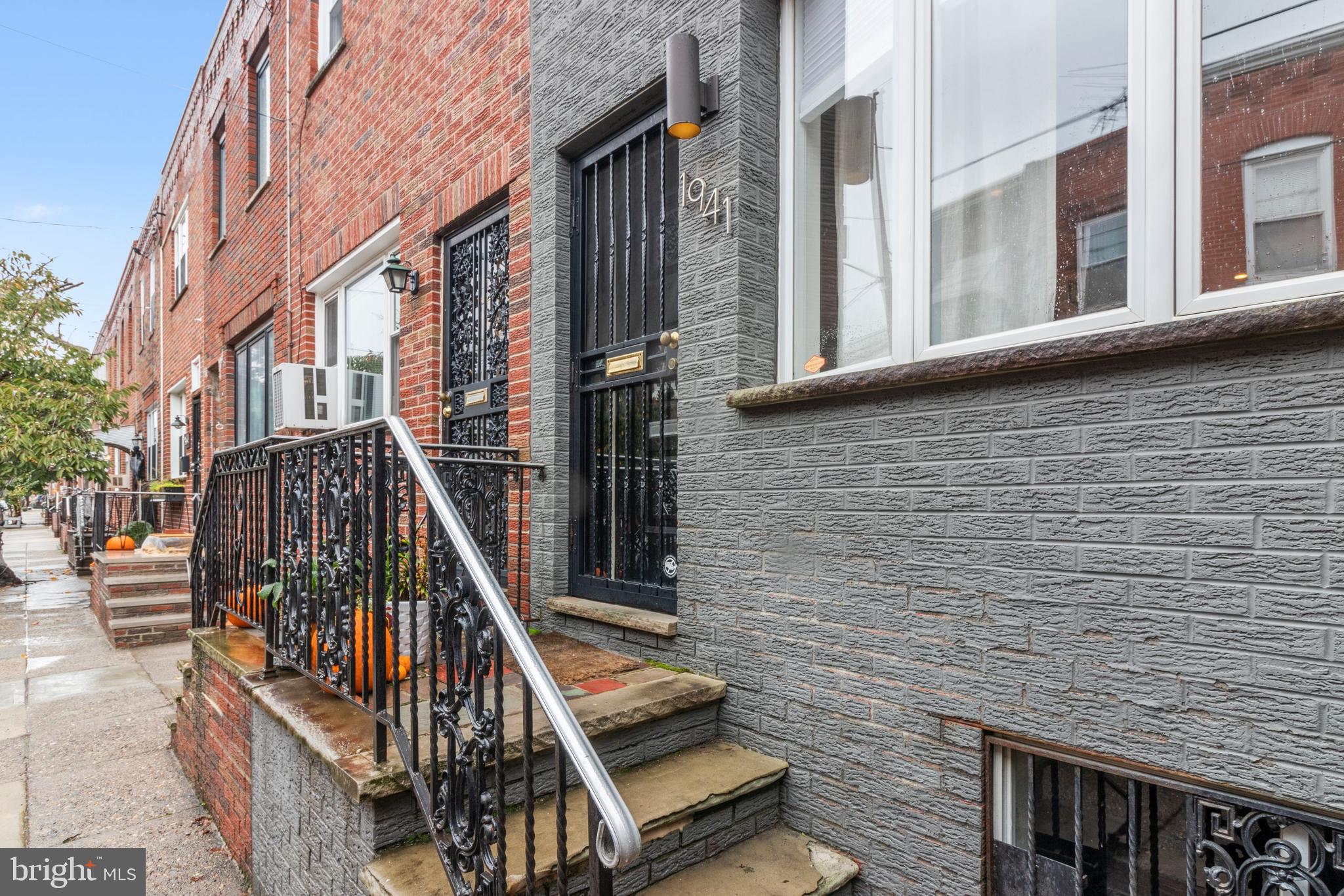 a view of a brick buildings with entryway and stairs