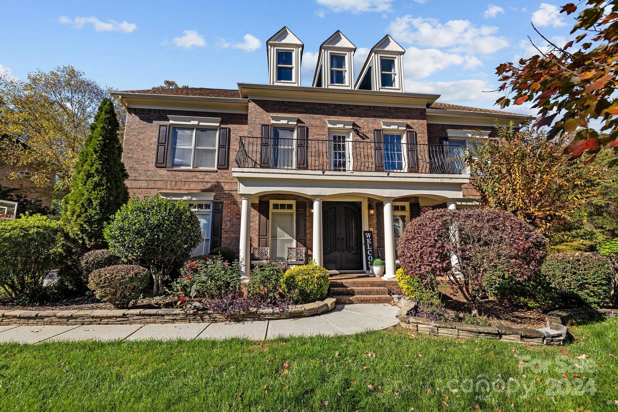 front view of a house with a yard