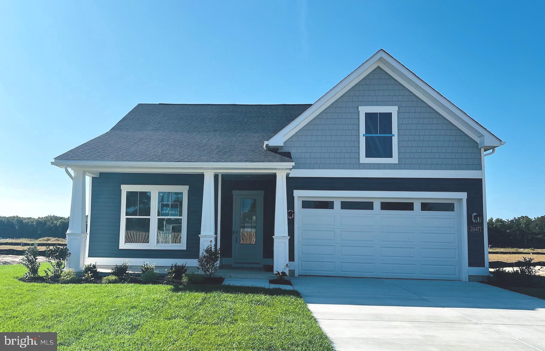 a front view of a house with a yard and porch