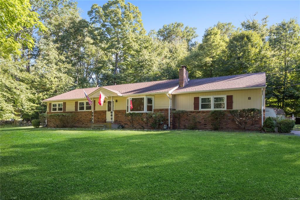 Ranch-style house with a front lawn