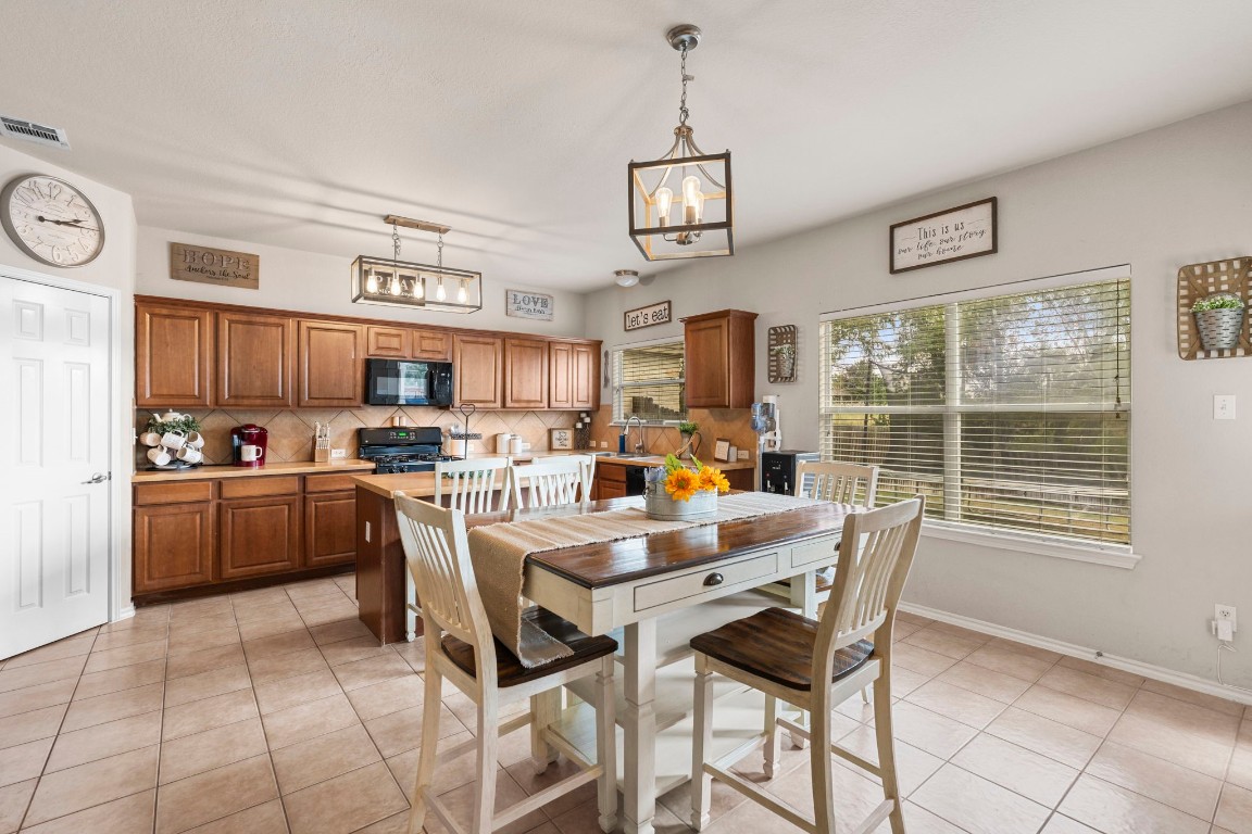 a view of a dining room kitchen and a window