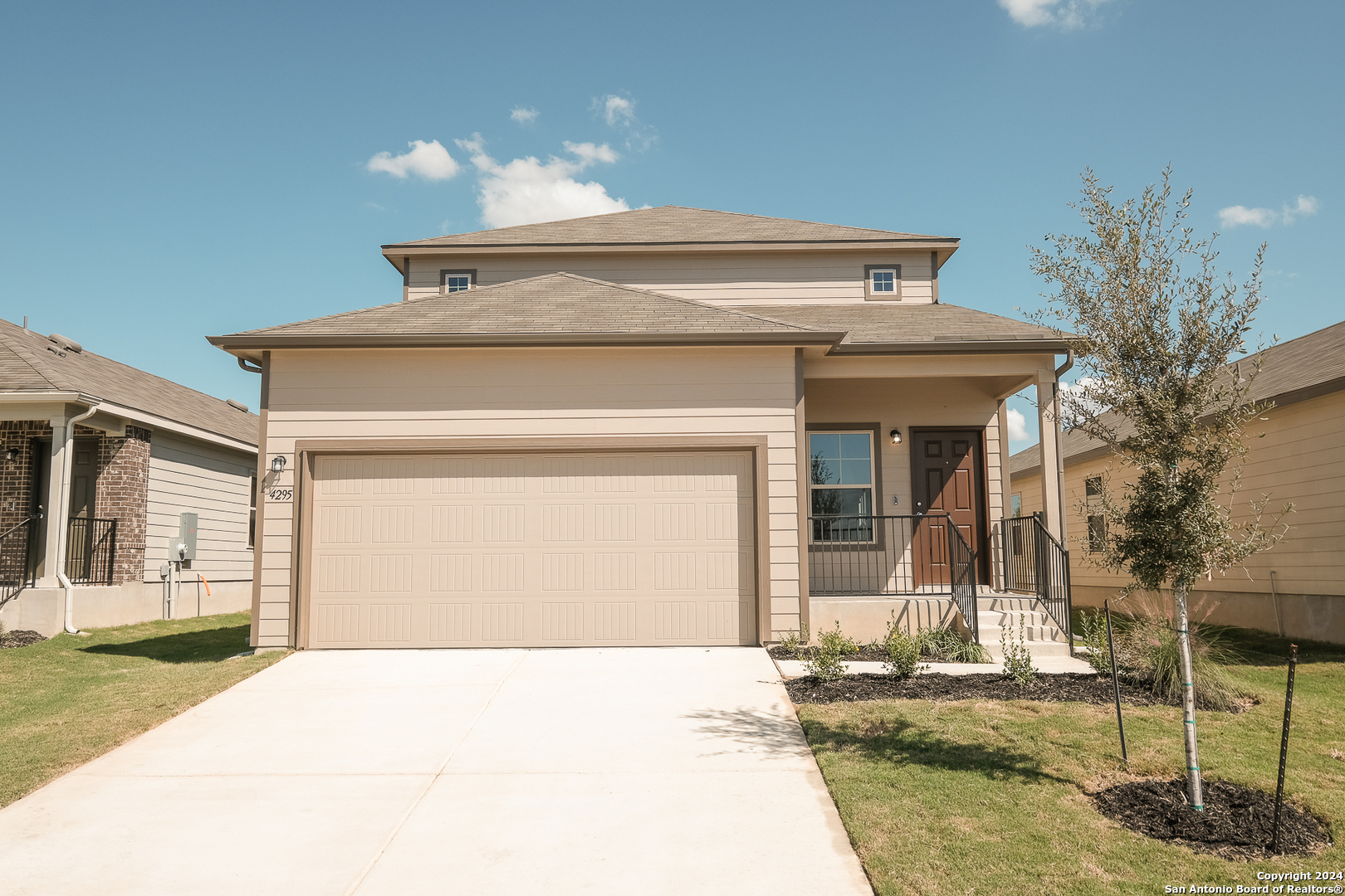 a front view of a house with garage