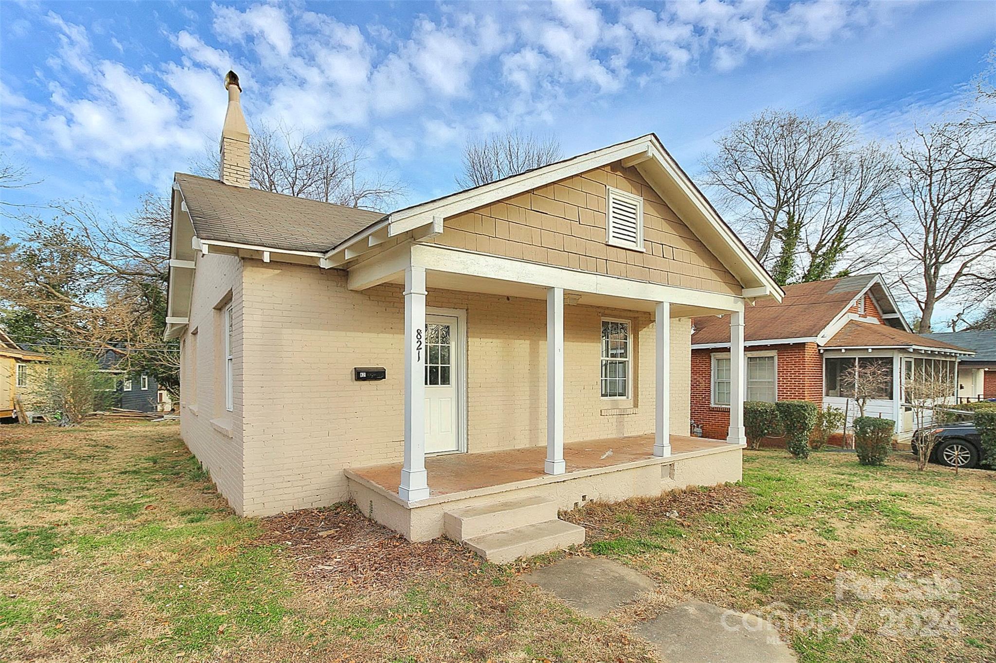 front view of a house with a yard