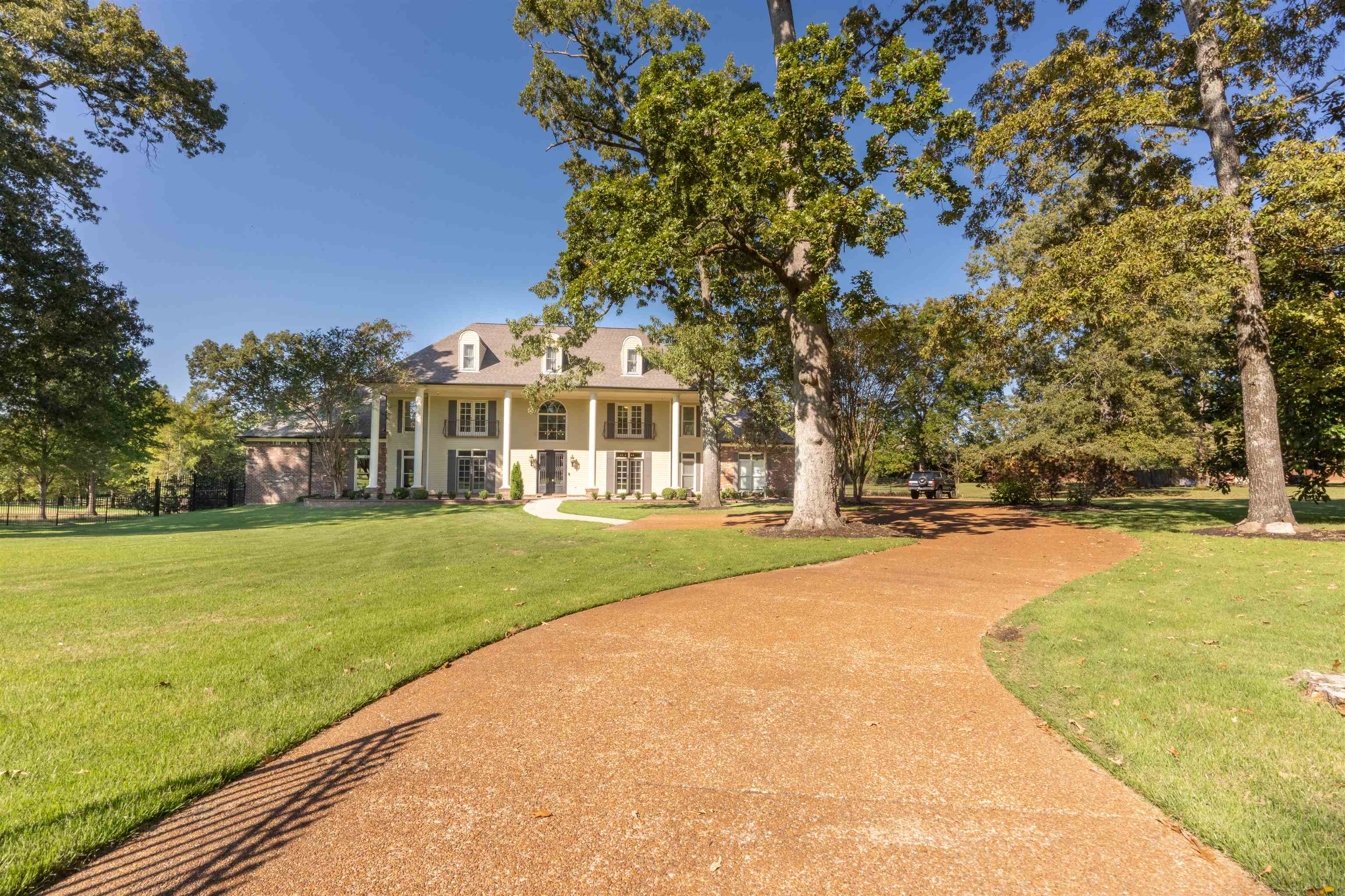 View of front of property with a front lawn and a porch