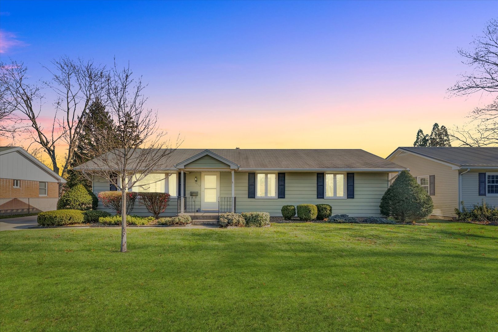 a front view of a house with a yard