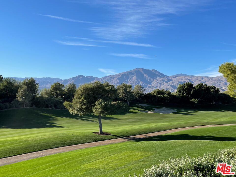 a view of a golf course with a lake