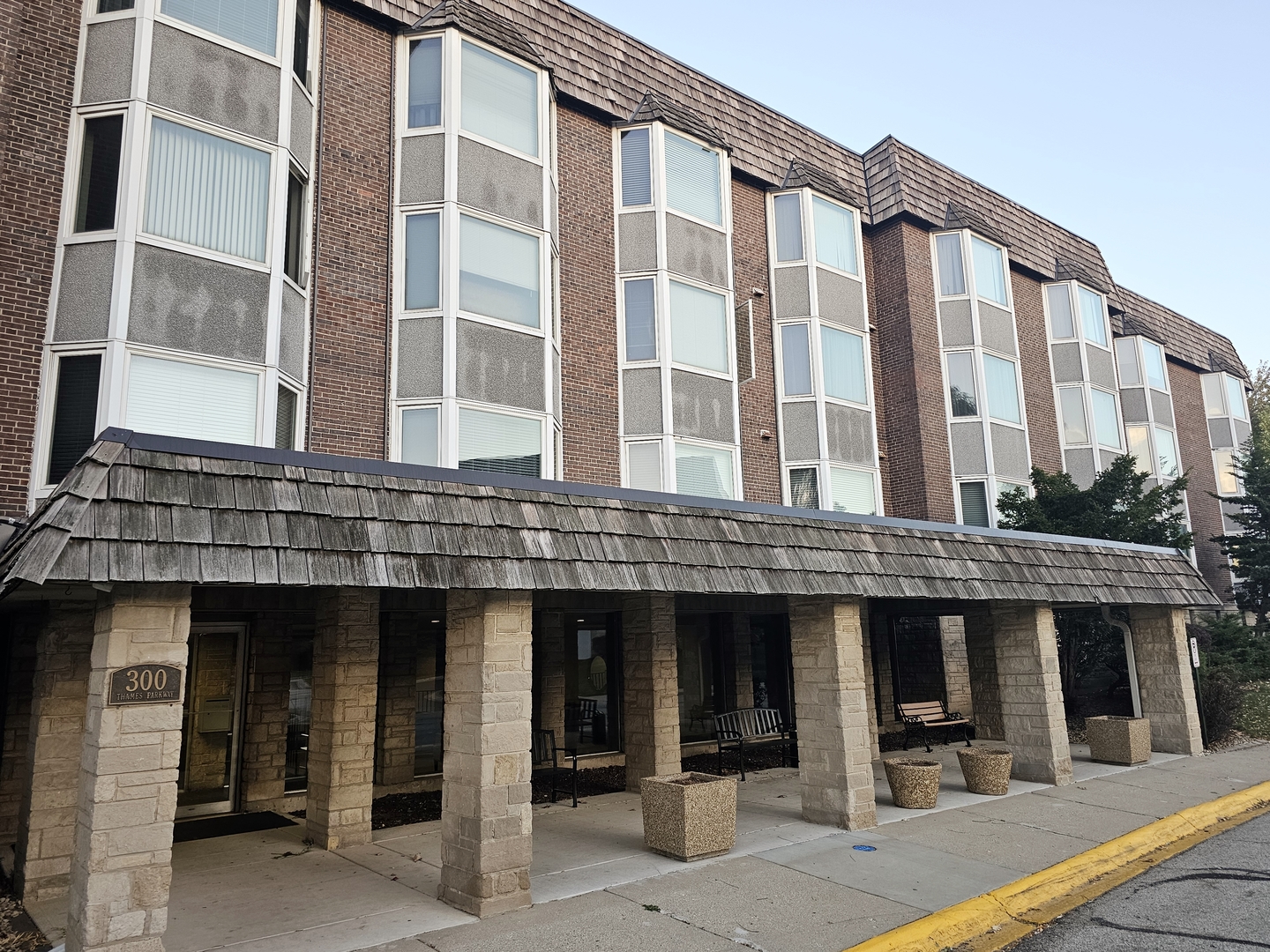 a front view of a building with glass windows