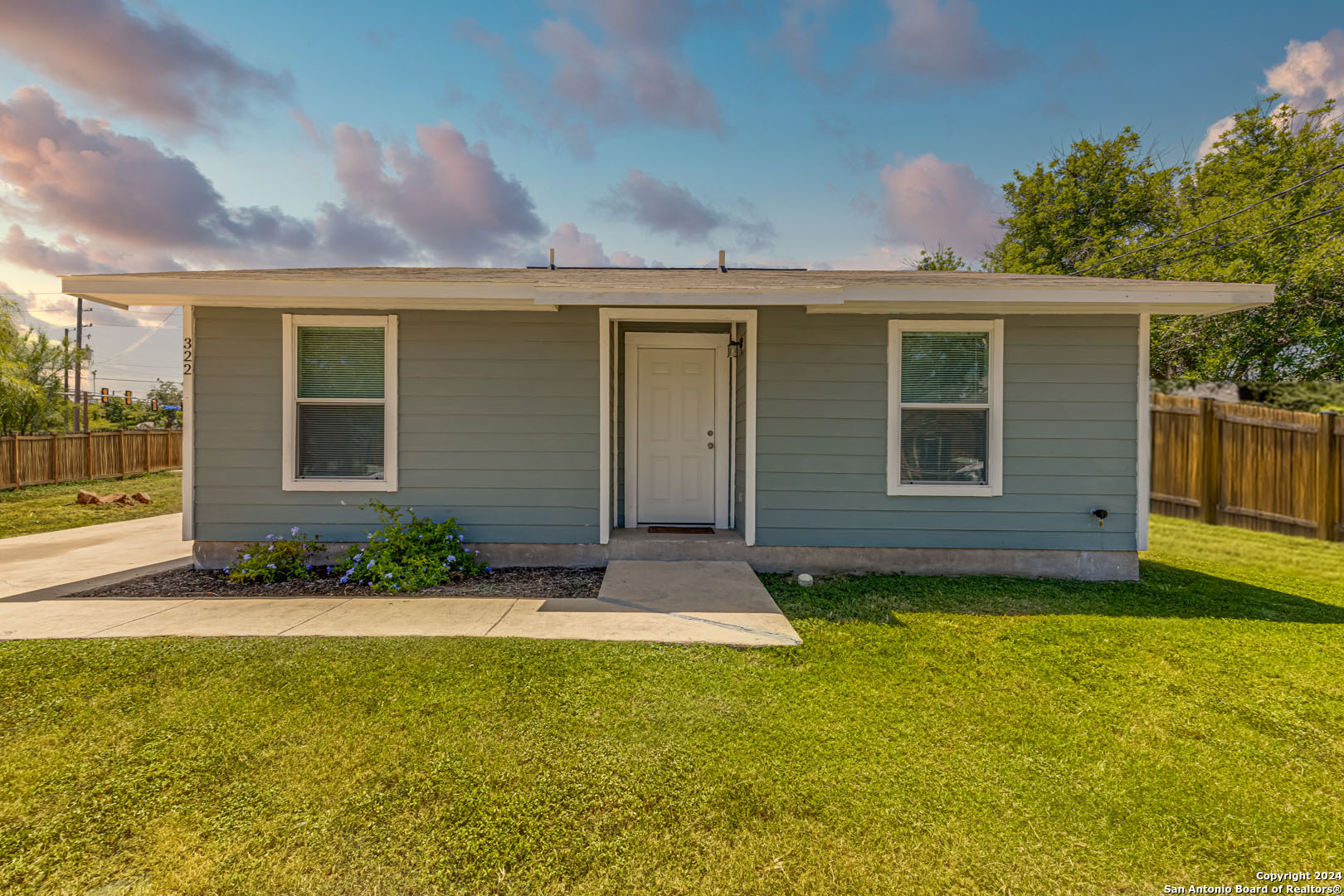 front view of a house with a yard