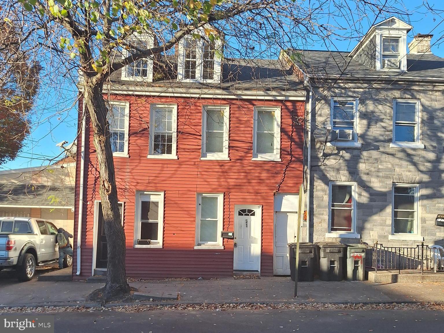 a front view of a building with parking